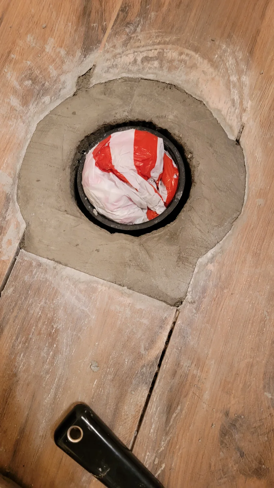 Toilet replacement & flange repair: concrete poured around the flange